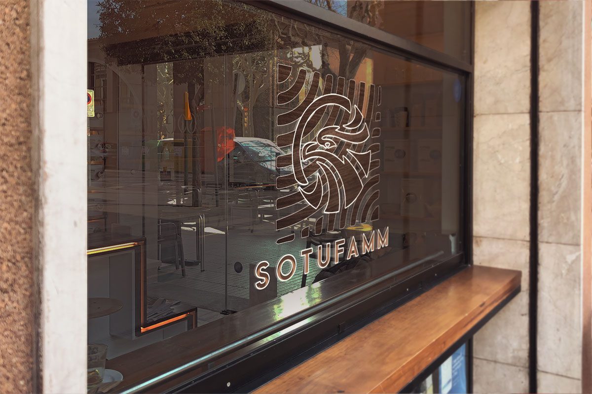 realistic view du logo Sotufamm de la création graphique, au Webdesign, au SEO optimisation des moteurs de recherche à la mise en place d'une stratégie de marketing digital logo imprimé sur un meuble
